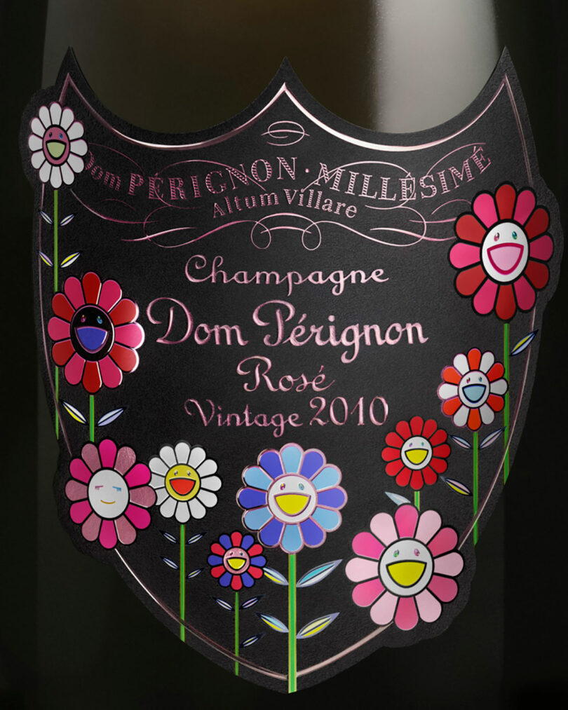 Label of a Takashi Murakami Dom Perignon Rosé Vintage 2010 champagne bottle, adorned with colorful, cartoon-style smiling flowers set against a sleek black background.