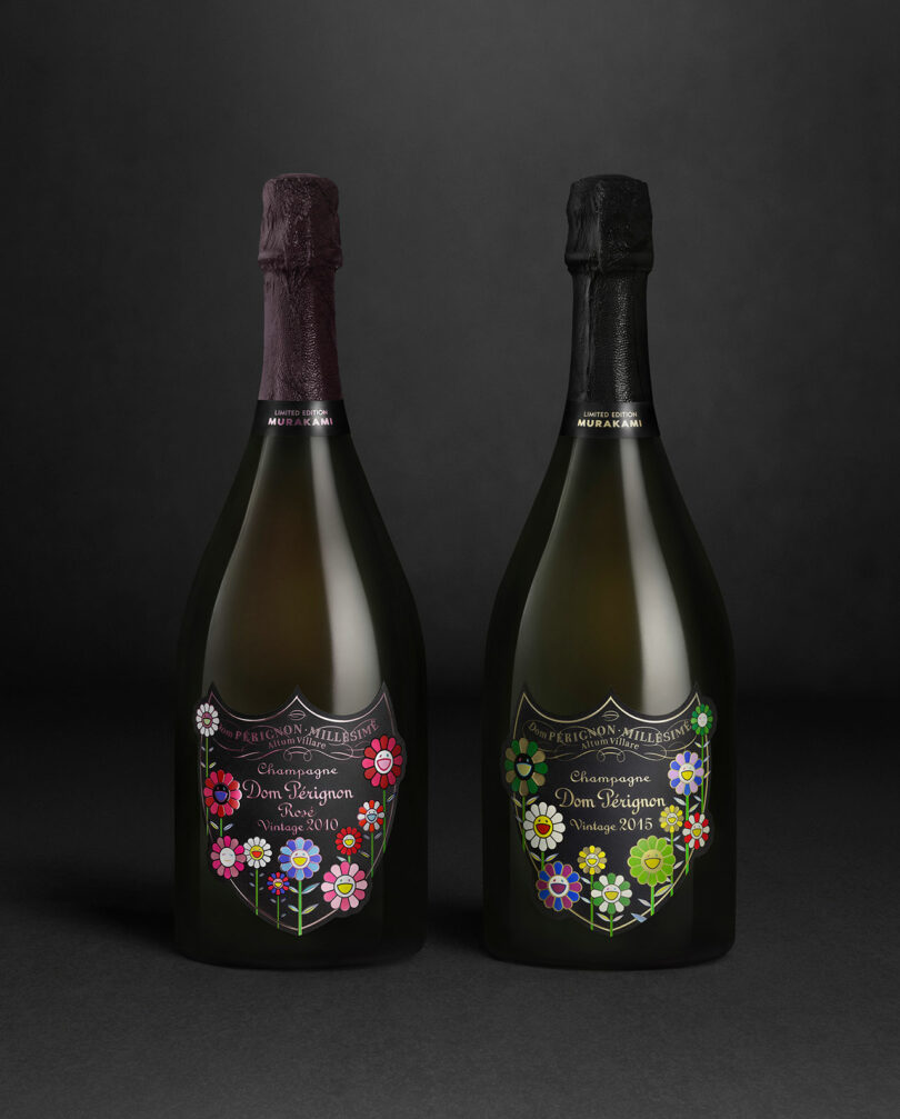 Two bottles of Takashi Murakami Dom Perignon champagne, featuring decorative floral labels—one with purple foil (2010), the other black foil (2013)—are displayed against a dark background.