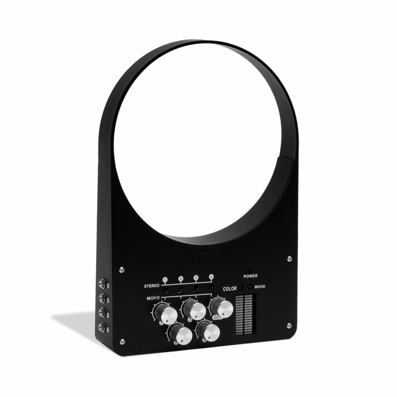 A black electronic device with a large circular opening, multiple knobs, switches, and LED indicators on the front panel.