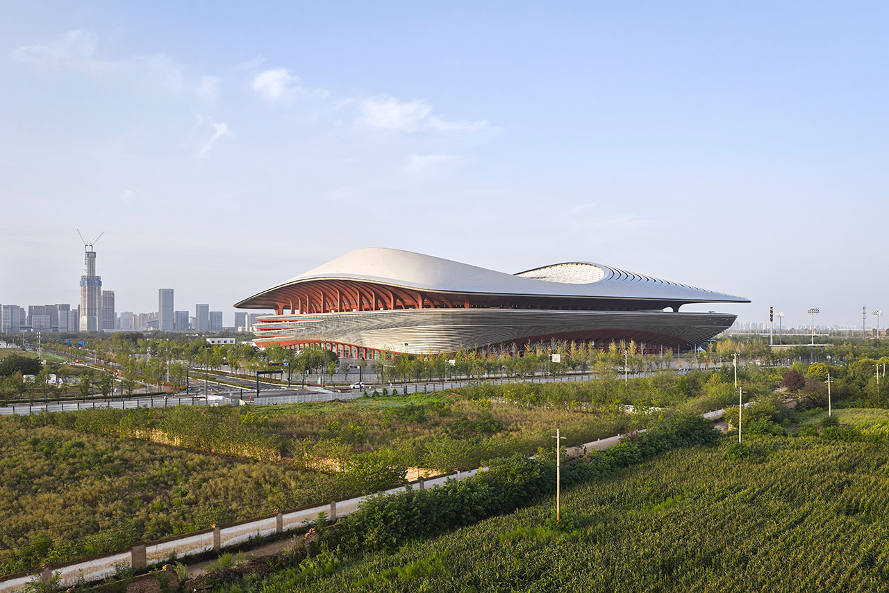 A Football Stadium With Fluid Forms Rises Above in China